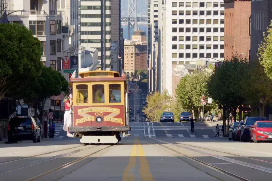 cable car driving down California Street